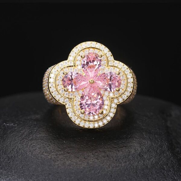 Detailed front view of gold moissanite flower iced out ring, hip hop jewelry for men