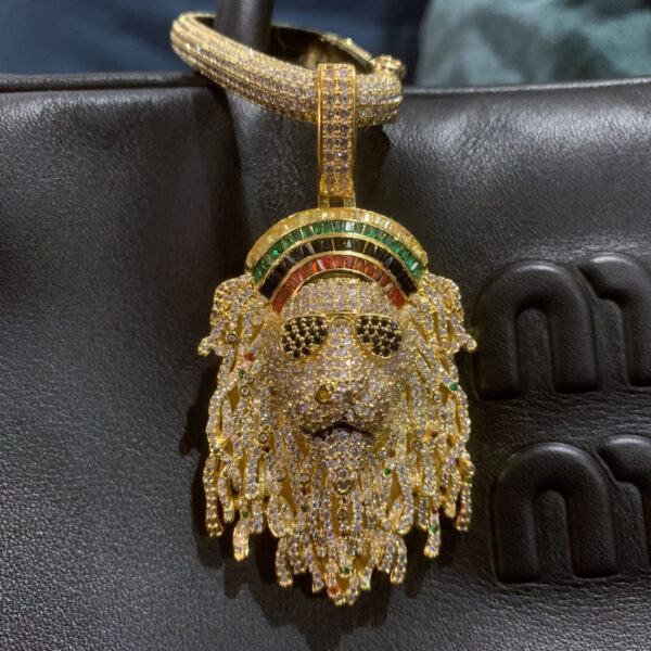 Close-up of ICETOPLUXE 18K gold-plated Lion head pendant, iced out with Zircon stones, hip hop style for men