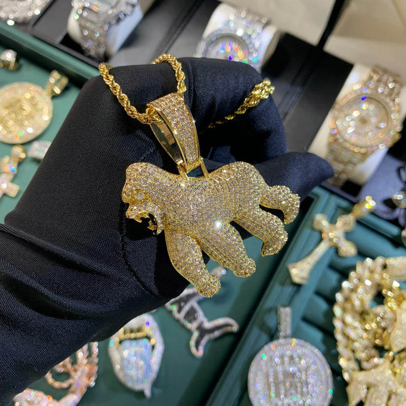 ICETOPLUXE detailed view of the iced out gold roaring gorilla pendant, showcasing premium craftsmanship