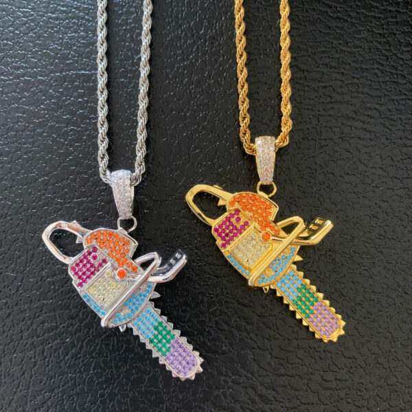 ICETOPLUXE gold and white chainsaw pendants shown side by side, perfect for LGBTQ pride jewelry lovers