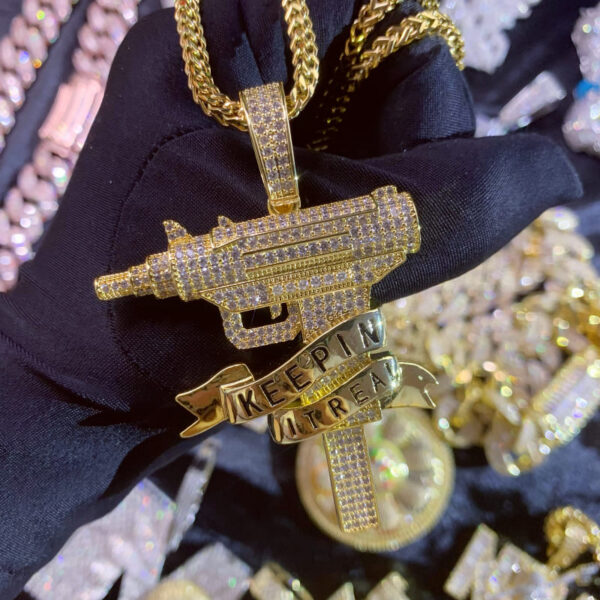 ICETOPLUXE front view of the iced out Uzi gun pendant, highlighting intricate CZ diamond details