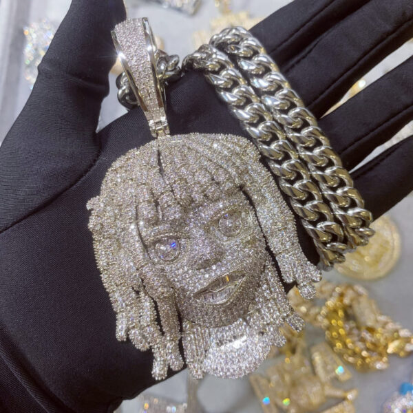 ICETOPLUXE front view of white iced out dreadlocks pendant on glossy Cuban chain, shining in the light