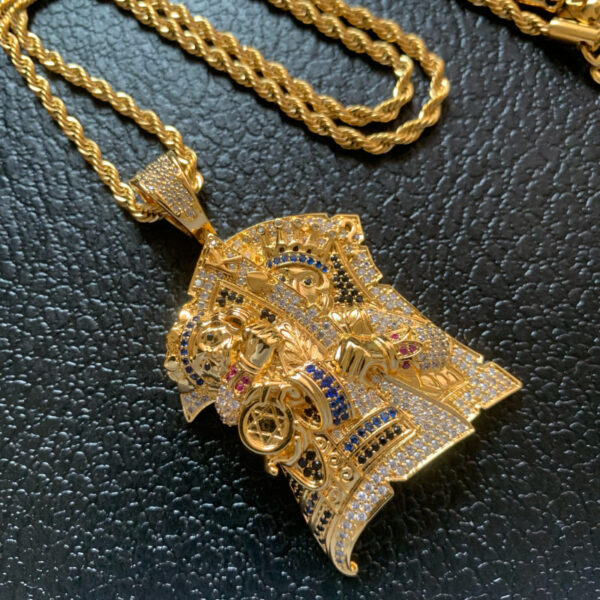 ICETOPLUXE iced out gold King Assassin pendant, perfect for adding bling to your hip hop jewelry collection