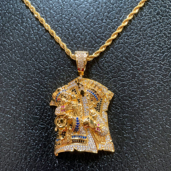 Close-up of ICETOPLUXE iced out King Assassin pendant, showcasing colorful CZ diamonds for men's hip hop style