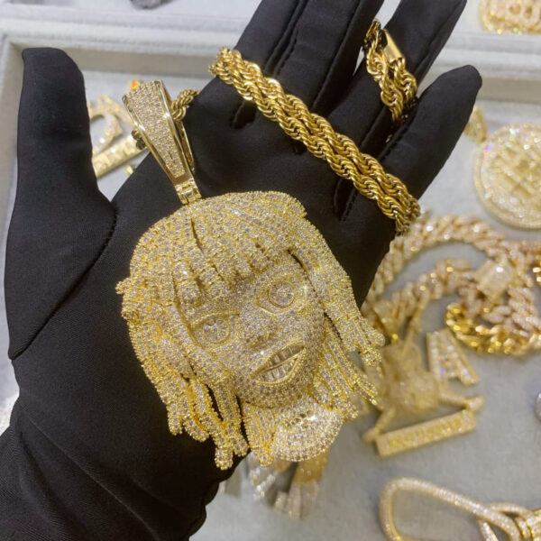 ICETOPLUXE front view of gold iced out dreadlocks pendant on rope chain, perfect for any hip hop style