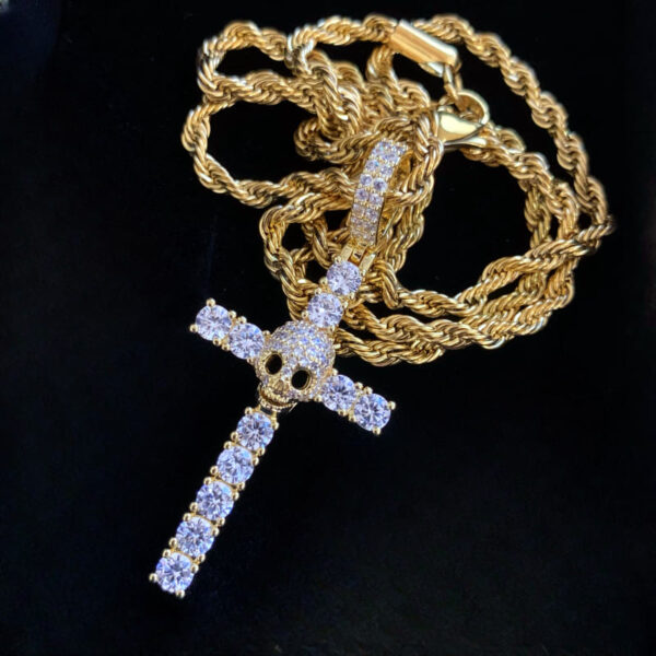 ICETOPLUXE gold skull cross pendant displayed alone, showcasing its brilliant cut CZ diamonds for style