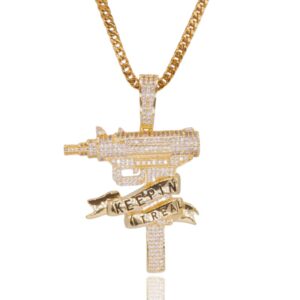 ICETOPLUXE men's iced out Uzi gun pendant on a white background, featuring stunning CZ diamond details