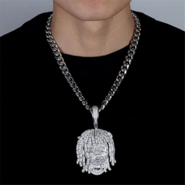 ICETOPLUXE model showcasing white iced out dreadlocks pendant with glossy Cuban chain, ideal for hip hop fashion