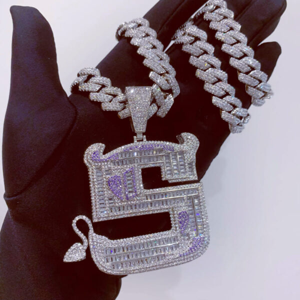 ICETOPLUXE S letter iced out pendant held in hand, featuring 14mm Cuban chain, great for everyday wear