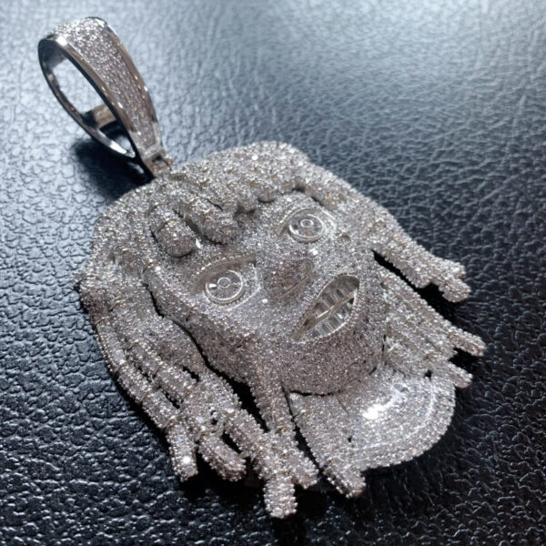 ICETOPLUXE side profile view of white iced out dreadlocks pendant, highlighting the design