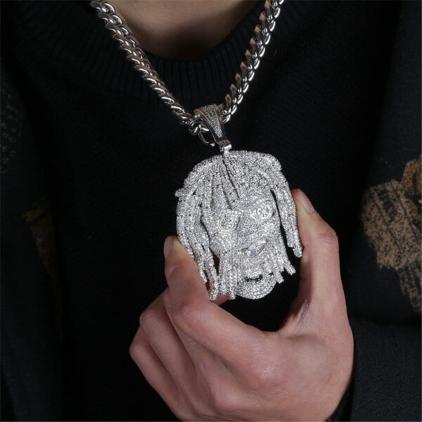 ICETOPLUXE stylish model featuring white dreadlocks pendant with glossy Cuban chain, perfect for street style