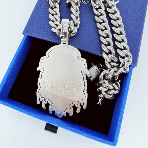 Back view of ICETOPLUXE white Lion head pendant, showing ICETOPLUXE logo with wing design and text engraving