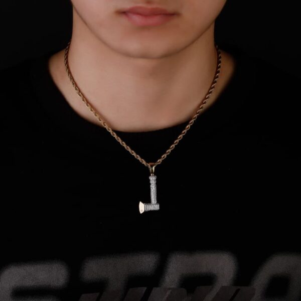 Model showcasing gold-plated axe pendant necklace with CZ stones, 20-inch chain, hip hop jewelry for men