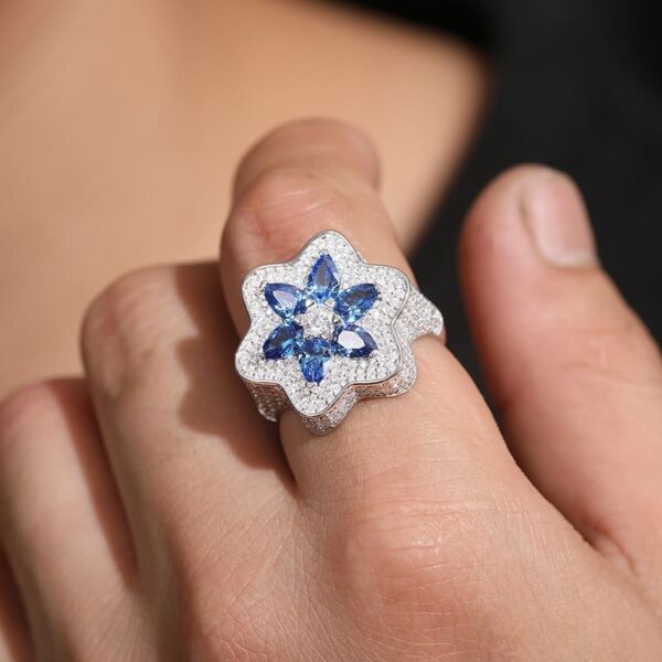 Model wearing Klein blue moissanite flower iced out ring, hip hop jewelry for rapper and DJ style