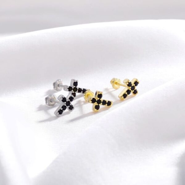 ICETOPLUXE gold and silver cross stud earrings with black zircon stones, ideal for a bold and fashionable look.