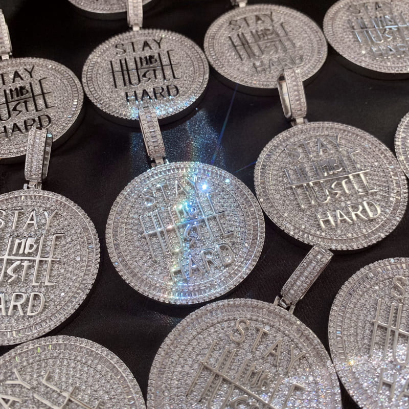 ICETOPLUXE collection of white iced out coin pendants, showcasing the beauty and craftsmanship of this elegant hip hop necklace.